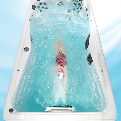 Woman swimming in an H2X swim spa